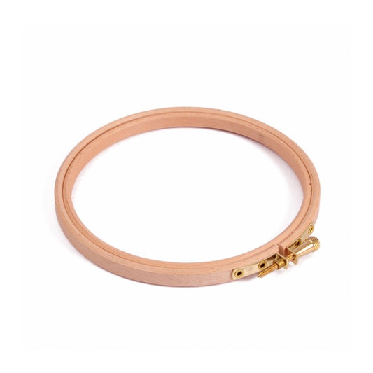 Wooden embroidery hoop on a white background