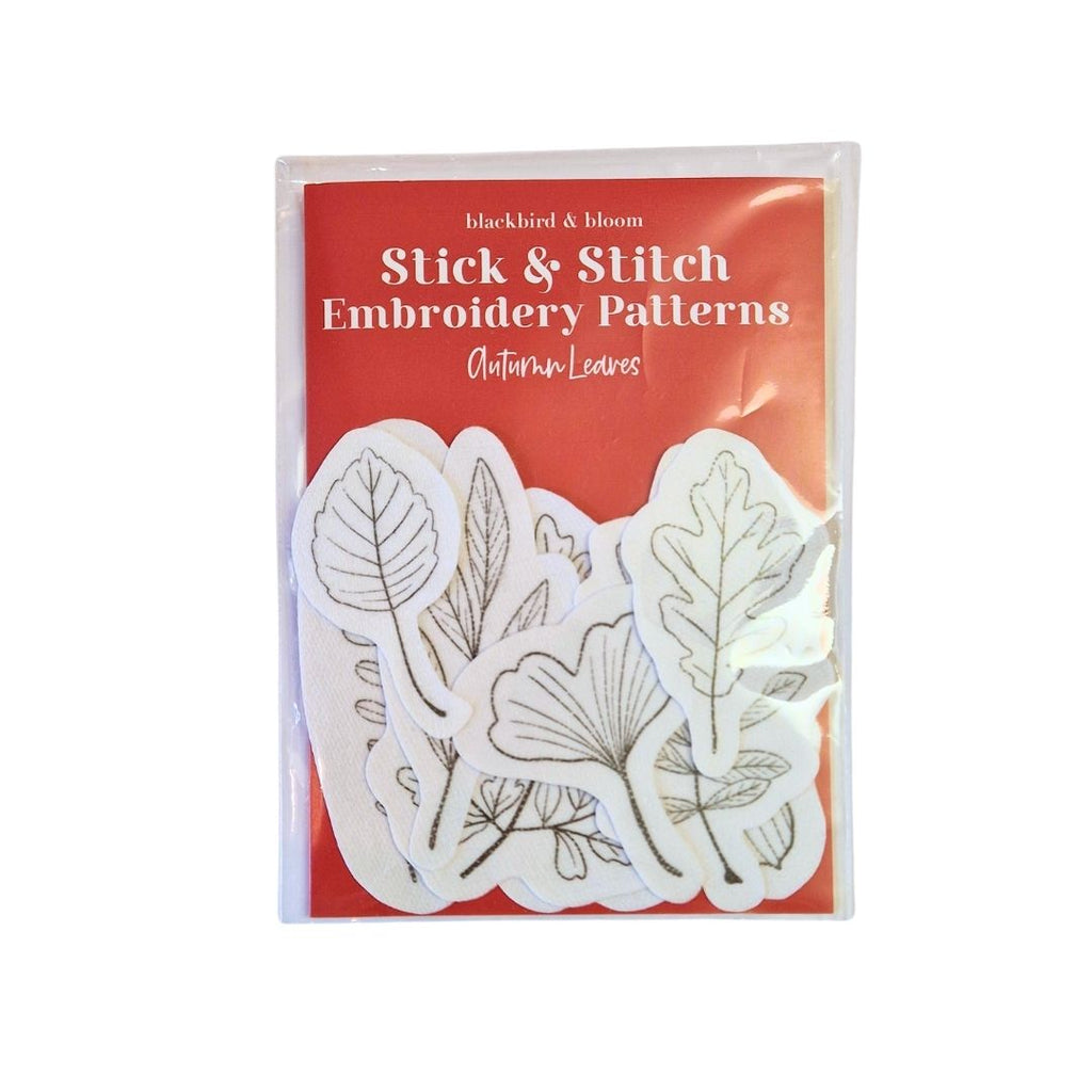 Pack of Stick & Stitch Embroidery Patterns with leaf designs on a red background