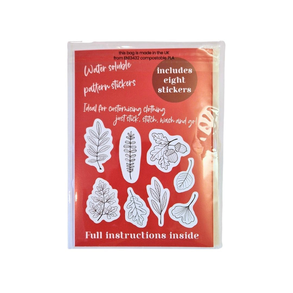Pack of water-soluble pattern stickers with leaf designs on a red background