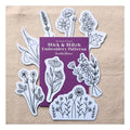 A set of floral embroidery patterns arranged around a purple booklet on a beige textured background. The booklet reads 'blackbird & bloom' Stick & Stitch Embroidery Patterns Beautiful Blooms'.