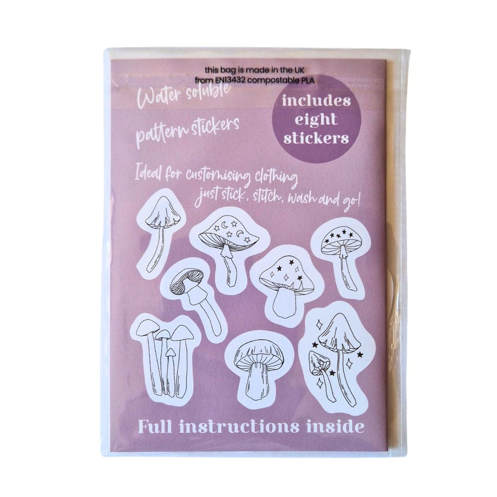 Pack of water soluble pattern stickers with mushroom designs on a purple background